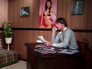 Ginger Lynn massages a big cock with her